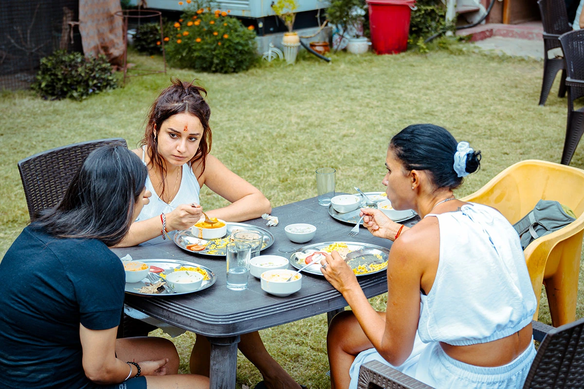 Students eating breakfast at Nirvana Yoga School Garden